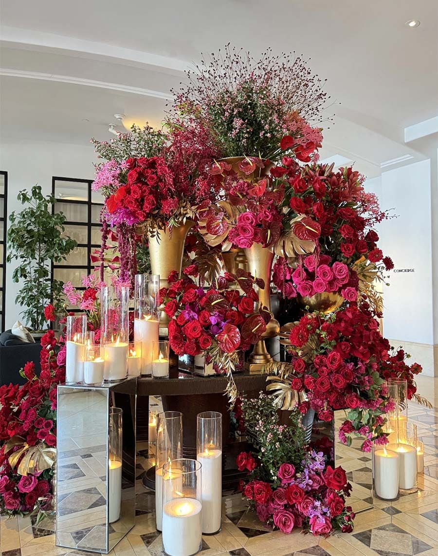 Decorative floral arrangement with candles in a room setting