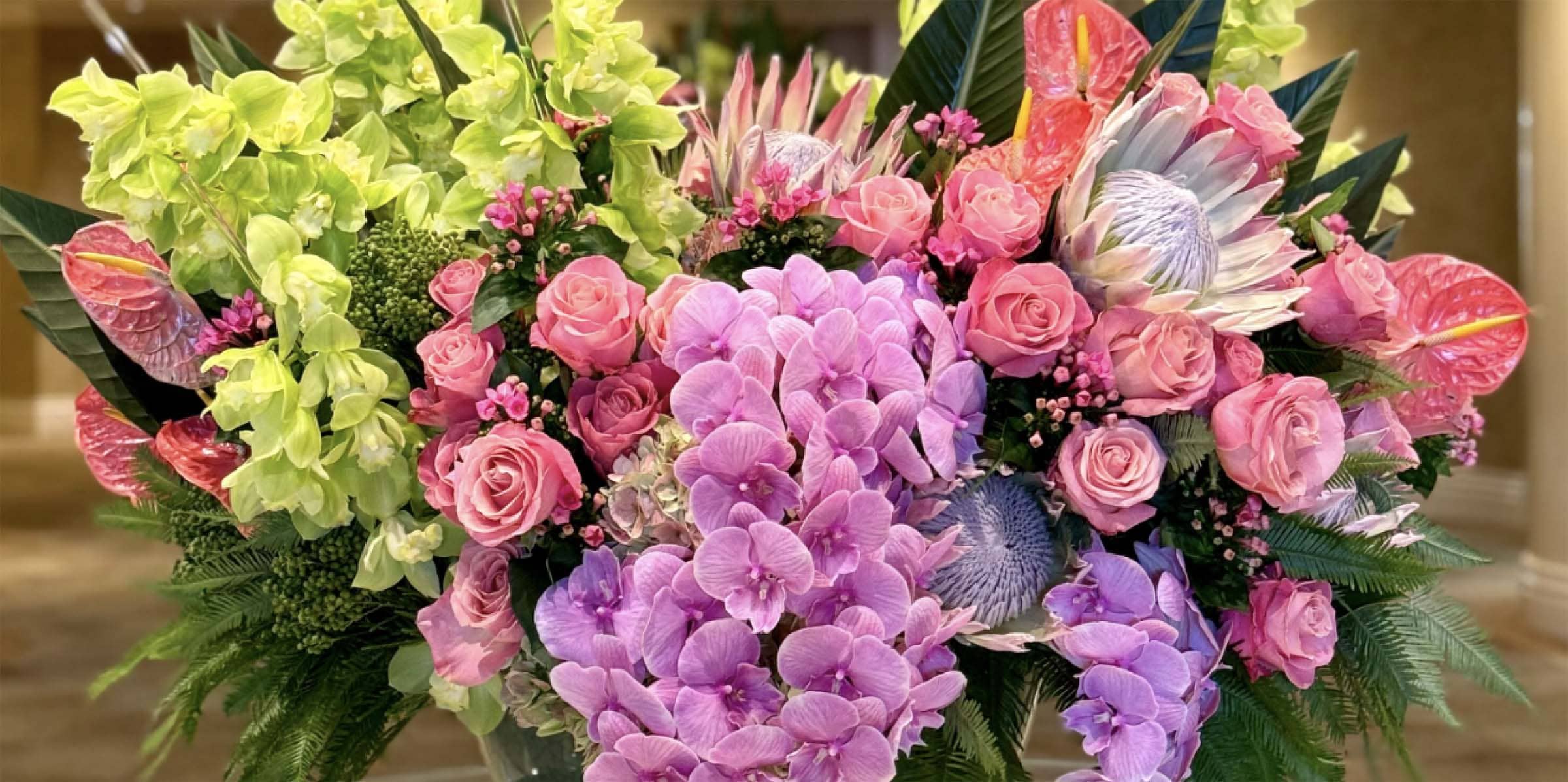 Bouquet of flowers with pink, purple, and green colors.